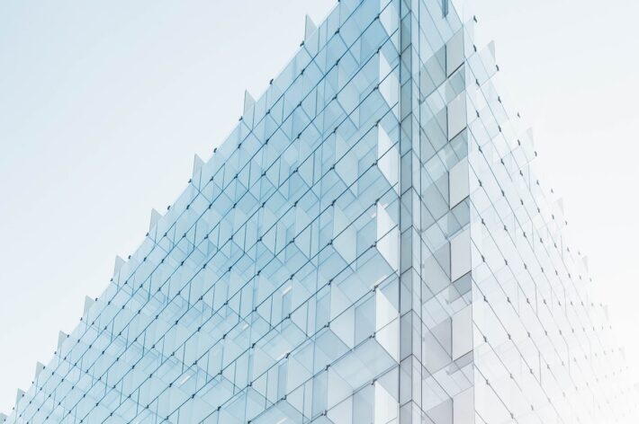 glass building under clear blue sky